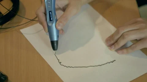 3D drawing pen close-up on a sheet of paper Stock Footage 67608829