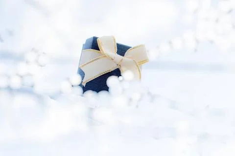 3d gift box on a layer of white fluffy clouds 3d rendering gift box on a l... Foto stock