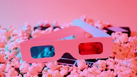 3D glasses on a clapperboard and popcorn Stock Footage 287999466