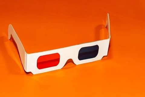3D glasses on orange background. Stock Photos