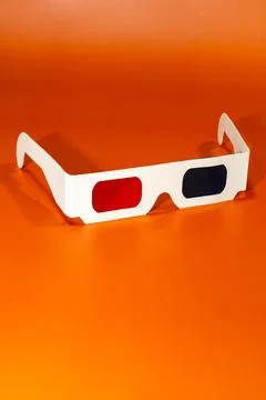 3D glasses on orange background. 写真素材