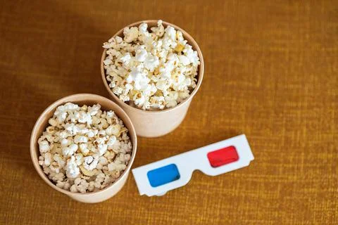 3D glasses with popcorn on couch Fotos Stock