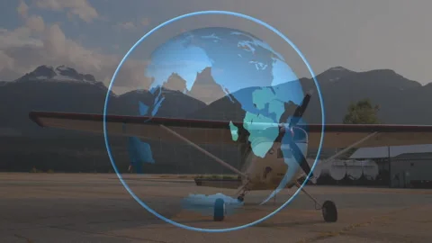 3D globe materializing before parked single-engine plane and rotating continents Stock Footage 314473137