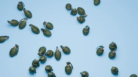 3D grenades scattered across a clean blue background Stock Footage 320507415