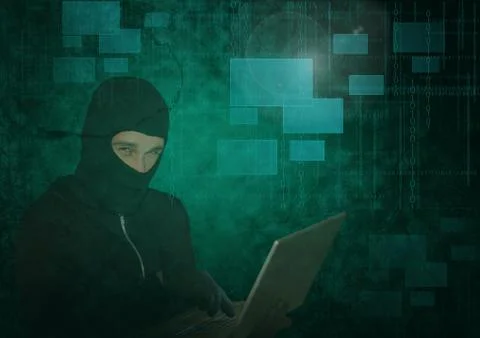 3d Hacker using a laptop in front of green digital background Foto stock