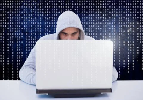 3d Hacker using a laptop in front of digital screen Stock Photos