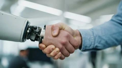 3D handshake between robotic arm and factory worker Video stock 317217397