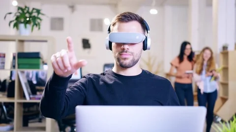 3D Hologram Game Developer In Modern Office Wearing Virtual Reality Vr Headset Video stock 77410511