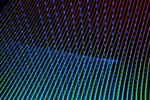 3D illustration and 3D rendering. Colored lights forming a futuristic wavy pa Stock Illustration