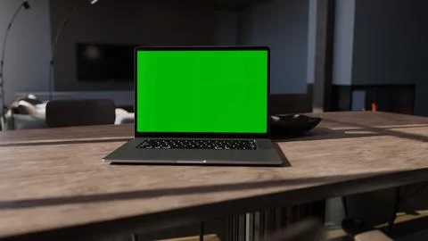 3D Laptop with green screen on display in home office Stock Photos