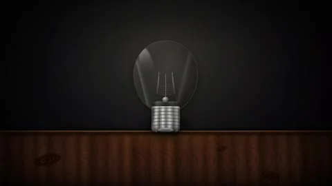 3D Light Bulb Glowing on Wooden Table Surface Motion Background  Stock Footage 345589690