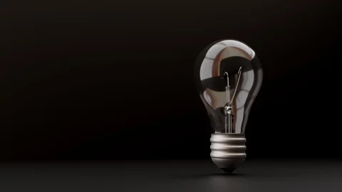3D light bulb lit on black background Stock Footage 120165948