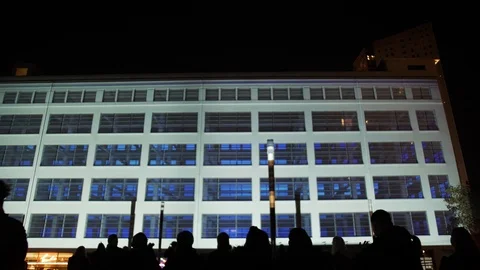 3D light show on outside wall of building at Glow festival in the Vídeos de archivo 120559992