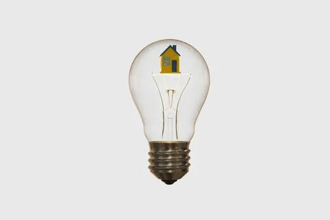 3D model of an incandescent light bulb and a house in the colors of the Ukr.. Stock Photos