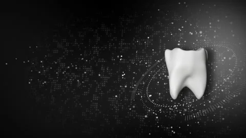 3d model of white tooth rotating on black background with glowing particles. Stock Footage 249655394