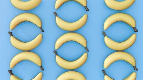 A 3D pattern of matte-yellow bananas on vibrant blue. Video stock 328137273