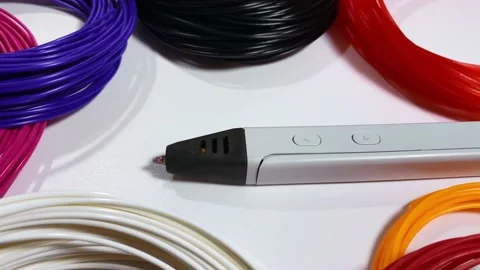 3D pen for drawing three-dimensional objects made of plastic and a lot of multi Stock Footage 167633180