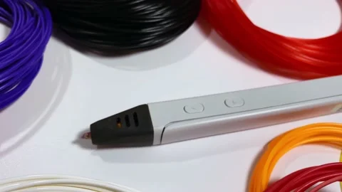 3D pen for drawing three-dimensional objects made of plastic and a lot of multi Stock Footage 167805259