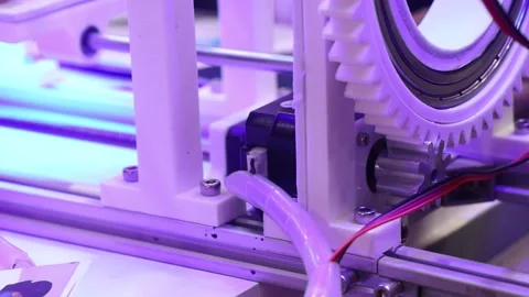 3d printed object with circular gear teeth being driven by a stepper motor Stock Footage 324738807