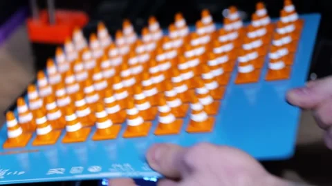 3D printed orange traffic cones on Prusa MK4S Stock Footage 344276092