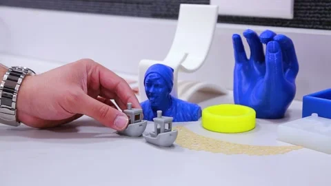 3D printed shapes in different colors, blue and yellow silver and white Stock Footage 163255516