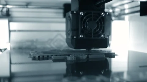 3D printer. 3d printer printing close-up. Molten plastic flowing out of extruder Stock Footage 237682830