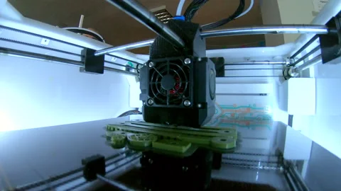3D printer. 3d printer printing close-up. Molten plastic flowing out of extruder Stock Footage 242928353