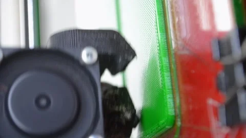 3D printer 3D printer printing object close-up printing model green Vertical Video stock 331181625