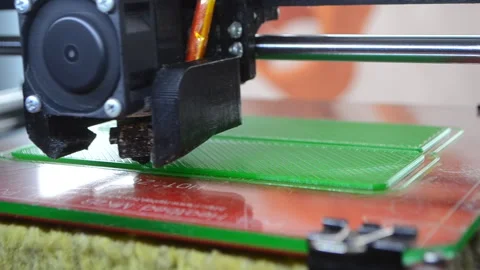 3D printer 3D printer printing object close-up 3D printer printing model green Stock Footage 331181643