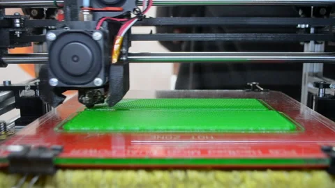 3D printer 3D printer printing object close-up 3D printer printing model green Video stock 331182216