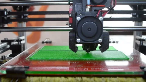 3D printer 3D printer printing object close-up 3D printer printing model green Stock Footage 331182365