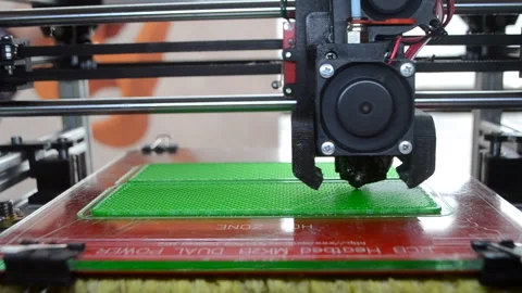 3D printer 3D printer printing object close-up 3D printer printing model green Video stock 331182669