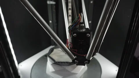 3D printer in action. 3D printer makes a plastic figure. View from above. Stock Footage 120687881