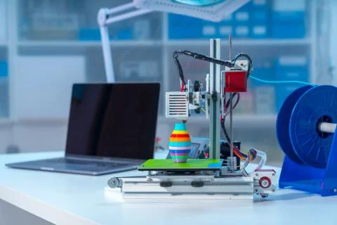 3D printer and computer on the table Stock Photos