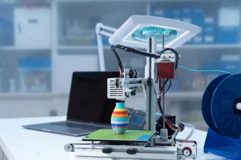 3D printer and computer on the table Stock Photos