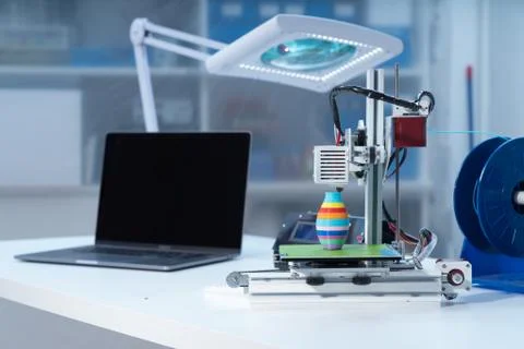 3D printer and computer on the table Stock Photos