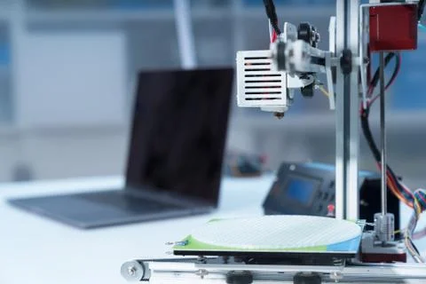 3D printer and computer on the table Stock Photos