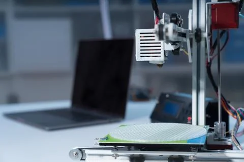 3D printer and computer on the table Stock Photos