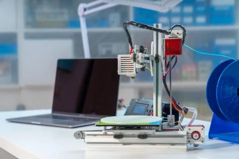 3D printer and computer on the table Stock Photos