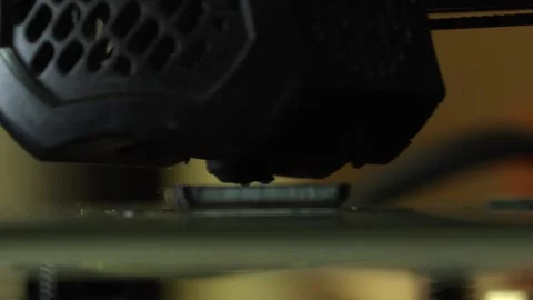 3D printer close up printing black block Stock Footage 276396140
