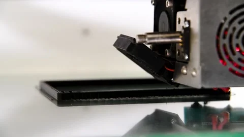 3D printer close-up printing the product. The printer elements are moving Видео 222584912