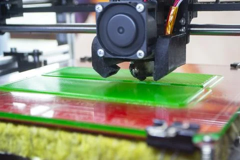 3D printer close up Working 3D printer process printing object molten plastic Stock Photos