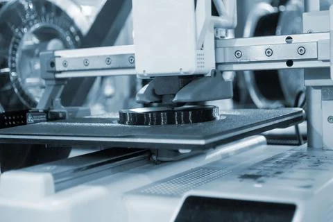 3D printer close up. Working 3D printer in process of printing object Stock Photos