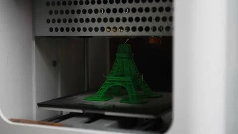 3D the printer creates an eiffel tower object with molten plastic close-up Stock Footage 150720570