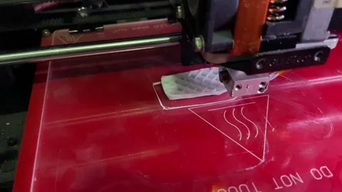 3d printer creates a small white test boat in pla plastic filament Stock Footage 256229369