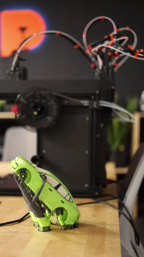 3D printer creates toys vertical video Stock Footage 286050937