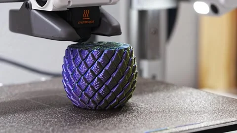 3D printer creating a colorful object in a shared workspace Stock-Footage 344421261