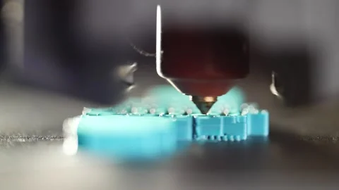 3D printer creating a plastic model layer by layer during detailed printing Stock Footage 322130845