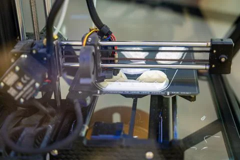 3D printer creating plastic objects with precision and speed. The concept Stock Photos