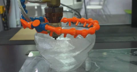 3d printer creating a translucent plastic bowl Stock Footage 313060243